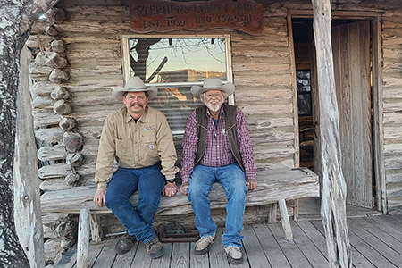 Jerry and Tye on the front porch of the office