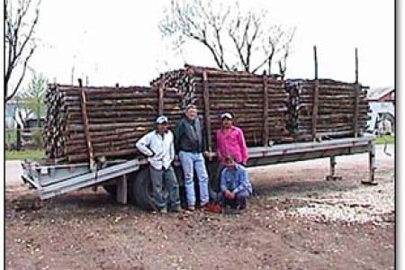 Jerry with some of his crew in front of a load of posts