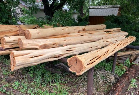 8.5'x8" posts machine peeled to finish grade for porch columns.