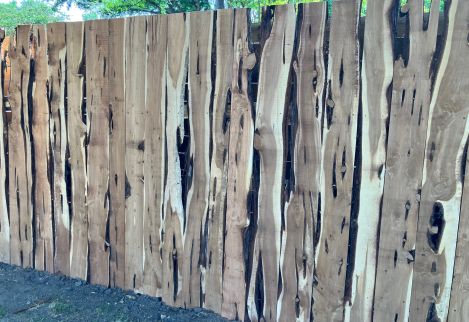 Our live edge boards work great for unique projects such as this semi-private fence.